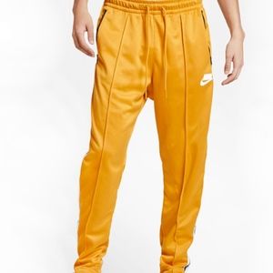 nike track pants yellow